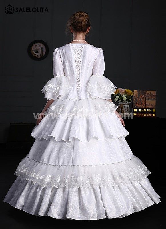 White Renaissance Victorian Era Dress Lace Ruffles Ball Gown     Condition: Brand New   Color:  White   Material: Brocade， Lace   Sleeve Length: Short Sleeve   Dresses Length:Floor-Length   Neckline:  Square Collar   Decoration: Ruffles + Lace + Flower   Package Includes: Dress            Whether you're looking for a Vintage Revolutionary,Regency,Early Victorian,Pioneer Women,Old West,Civil War Era,Polonaise Sets,Victorian Era,Edwardian, Bustle Dresses Clothing or Hi White Floor-length Dress For Costume Party, White Ruffled Gown For Costume Party, Formal Ball Gown Dress With Attached Cancan, Ruffled Ball Gown Corset Dress For Wedding, Elegant Prom Dress With Attached Cancan, Elegant Dress With Attached Cancan For Prom Season, Wedding Ball Gown Corset Dress With Ruffles, Floor-length Corset Dress For Debutante Ball, White Ball Gown For Costume Party