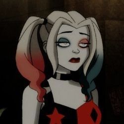 an animated image of a woman with white hair and blue eyes wearing a red star