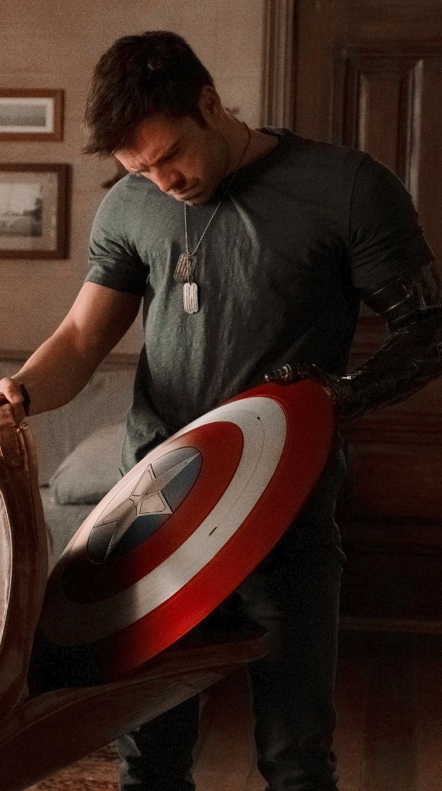 a man holding a shield in his hand