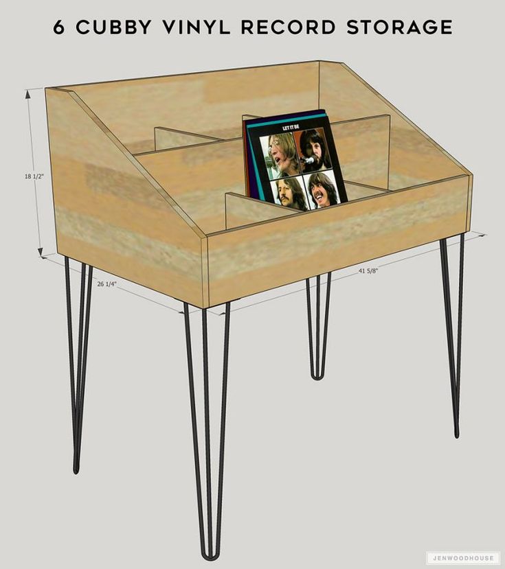 a coffee table with hairpin legs and an album on the top that has been turned into a record storage