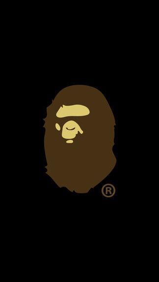 a brown gorilla face on a black background