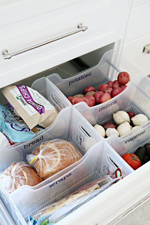 an open refrigerator door with plastic containers filled with food