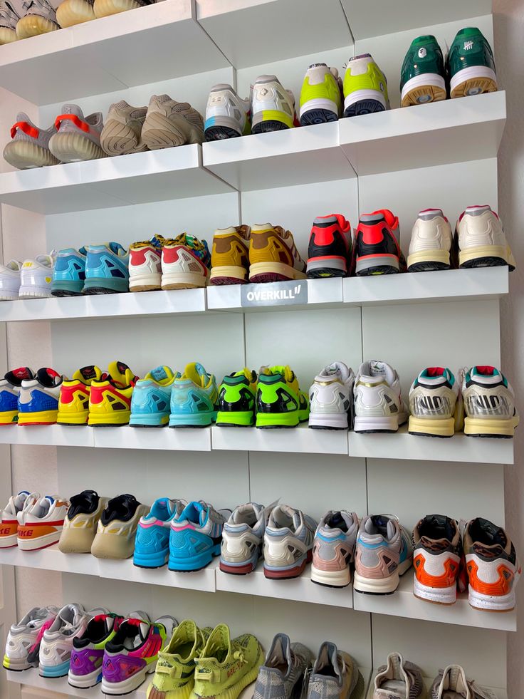 there are many pairs of shoes on the shelves