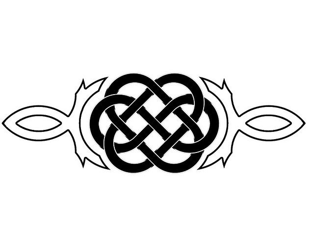 the celtic knot tattoo design is shown in black and white, with two leaves on each side