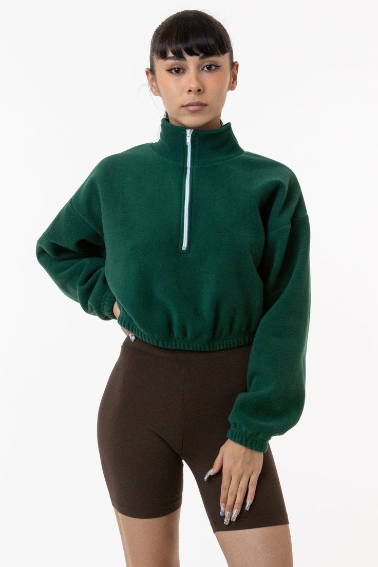 Introducing the Polar Fleece Half Zip. This unisex pullover features elastic hems around the middle of the waist and at the wrists and this style can be worn zipped up or down. Casual and functional with a generous fit to the body and arms. Perfect for layering over our crop tops and bike shorts. This product is made in South Central, Los Angeles. Our experienced seamstresses earn an average up to $20 an hour or more and no less than $15. Plus benefits and overtime. Cropped Outfits, Cute Sporty Outfits, Cropped Half Zip, Yoga Jumpsuit, Plus Size Romper, Crop Top Outfits, Sweaters And Leggings, Sporty Outfits, Half Zip Pullover