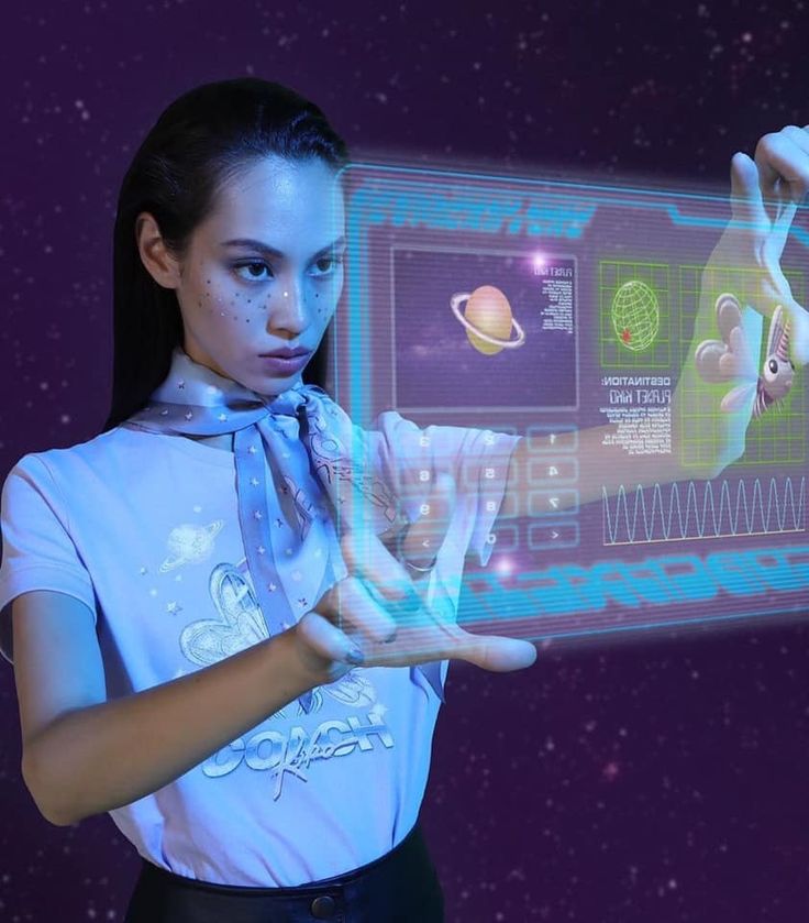 a young woman is holding out her hands to touch the screen