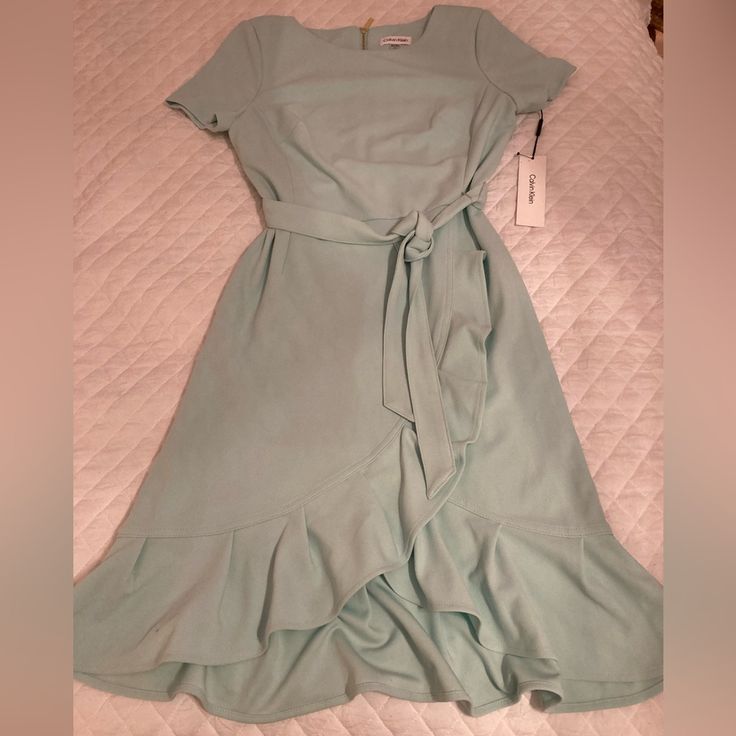 Calvin Klein Dress Size: 6 Color: Mint Green Brand New With Tags! *Please Note Dress Does Have Some Minor Signs Of Dirt Dress Was Possibly Dropped In A Store. Looks Easy To Spot Clean. *Smoke Free Home *Pet Free Home Casual V-neck Calvin Klein Dress, Calvin Klein Casual V-neck Dress, Calvin Klein A-line Midi Summer Dress, Calvin Klein A-line Midi Dress For Spring, Chic Knee-length Calvin Klein Dress, Chic Calvin Klein Knee-length Dress, Spring Calvin Klein Fitted Midi Dress, Fitted Calvin Klein Midi Dress For Spring, Chic Calvin Klein Short Sleeve Mini Dress