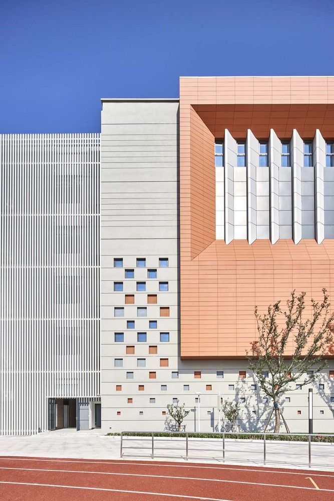 an orange and white building on the side of a road