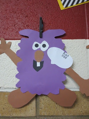 a paper cut out of a purple monster