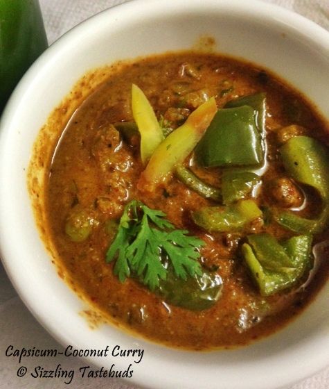 a white bowl filled with chili and green peppers