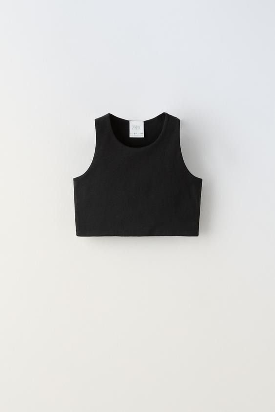 SLEEVELESS CROP TOP - White | ZARA United States Casual Cropped Vest Crop Top, Trendy Cropped Tank Top, Trendy Cropped Fitted Tank Top, Stretch Cropped Vest Top, Trendy Sleeveless Stretch Crop Top, Trendy Stretch Sleeveless Crop Top, Chic Cropped Fitted Tank Top, Fitted Cotton Crop Top With Scoop Neck, Chic Seamless Fitted Crop Top