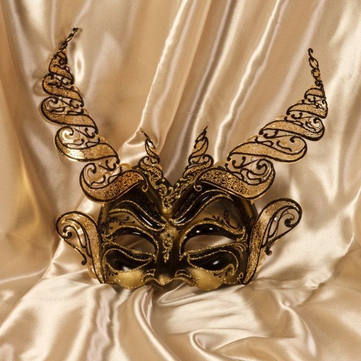 Half Devil Mask Paper Mache mask,with metal insert. Venetian Mask for to wear and for decoration - Traditional and original papier-mache Venetian mask, handmade and decorated with metal insert, gold-leaf and glitters,enriched with Swarovski crystals. Dimension: All our masks are handmade papier-machè masks made in Venice. Our decorators use techniques typical of the Venetian tradition such as stucco, acrylics, gold and silver-leaf, macramè, passementerie, glitters and crequelè to offer you a wid Gold Masks For Halloween Costume Party, Gold Venetian Mask For Halloween, Gold Costume Masks For Halloween, Full Face Gold Masquerade Mask For Carnival, Venetian Gold Masquerade Mask For Halloween, Gold Venetian Masquerade Mask For Halloween, Gold Eye Mask For Costume Party, Gold Eye Mask For Halloween, Gold Fantasy Mask For Costume Party