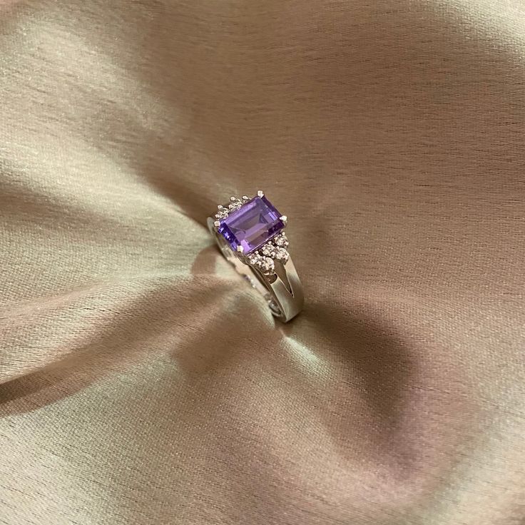 Elevate your style with our Amethyst CZ Sparkle Ring, meticulously crafted in silver and adorned with a stunning amethyst CZ stone for a luxurious and vibrant appearance. The ring also features unique 5A lab-created diamonds by CZ, adding to its high-quality and real diamond feel. Finished with 18kt gold plating and a highly-reflective rhodium polish, this ring not only dazzles but also ensures durability and prevents tarnishing. Finish: White Gold Plating Material: Silver, Alloy, CZ Stones, Ame Artificial Jewelry, Sparkling Rings, Amethyst Color, Jewelry Indian, Cz Ring, Lab Created Diamonds, Cz Stone, Real Diamonds, Gold Plating