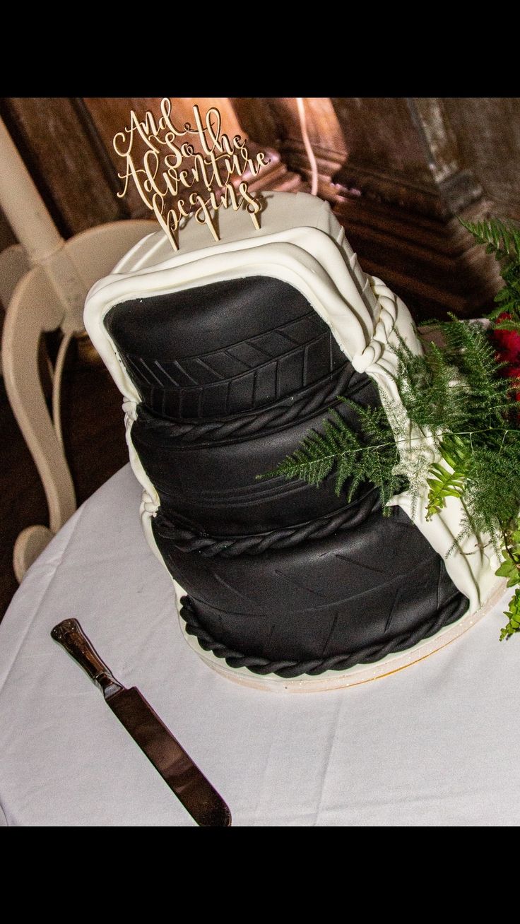 there is a cake made to look like motorcycle tires on top of a white table cloth