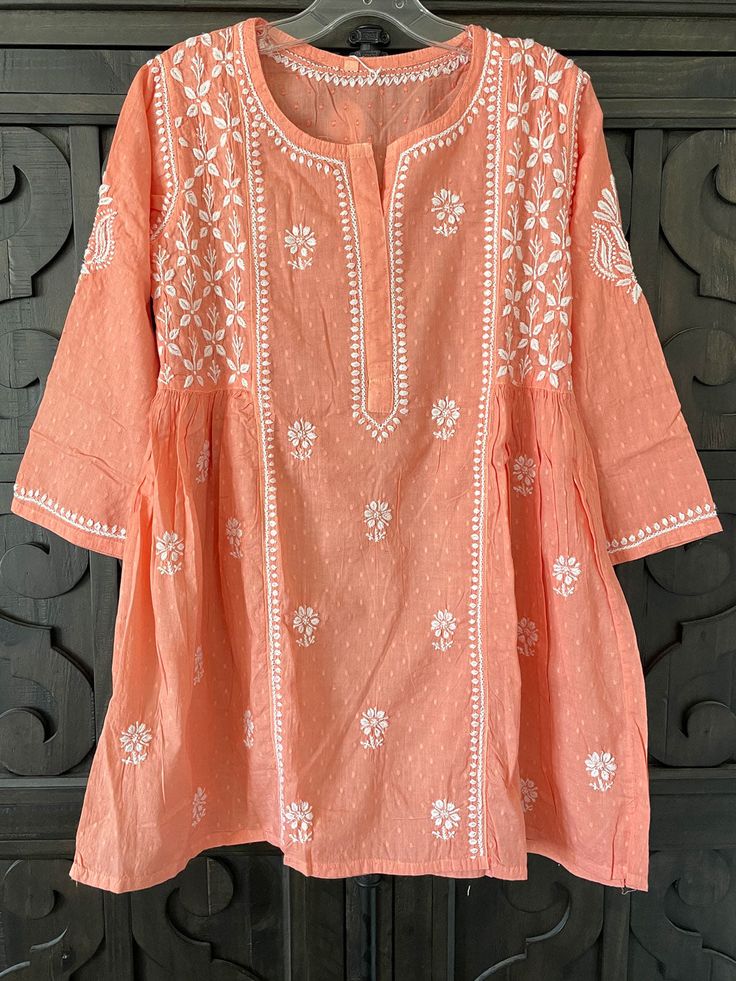 Women's Coral Color Pure Cotton Kurti Lucknowi Hand Embroidered Top at PinkPhulkari California Anarkali Tunic With Resham Embroidery For Summer, Summer Anarkali Tunic With Resham Embroidery, Festive Anarkali Tops For Spring, Spring Anarkali Long Sleeve Blouse, Straight Kurta Tops For Navratri Festive, Traditional Navratri Tunic With Printed Motifs, Spring Anarkali Top With Long Sleeves, Spring Anarkali Long Sleeve Tops, Festive Straight Kurta Tops With Cutdana