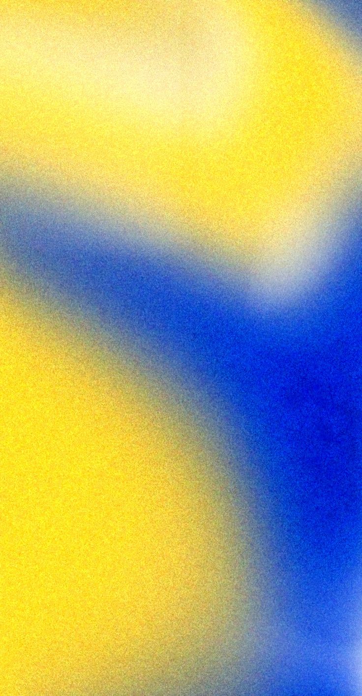 a blurry image of a yellow and blue background