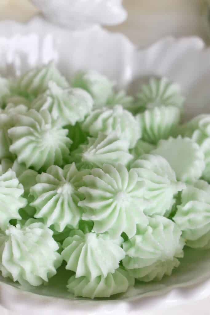 green frosted flowers in a white bowl