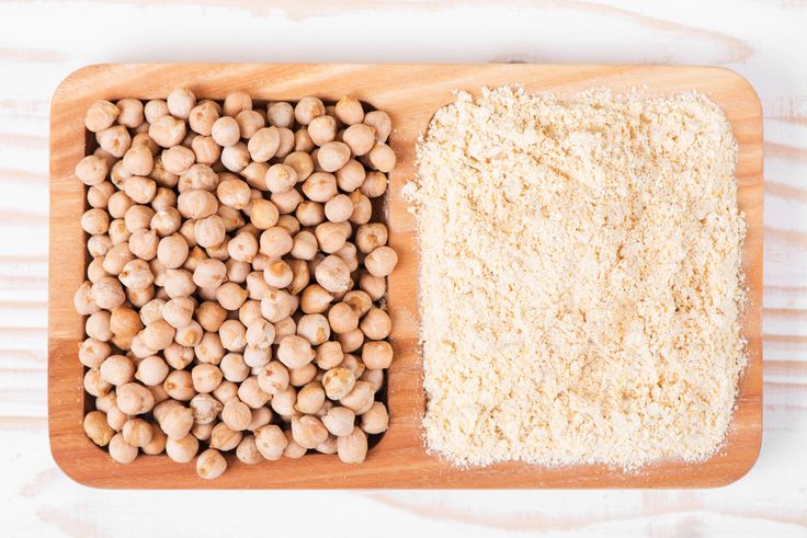 two different types of food on a cutting board, one with rice and the other with chickpeas