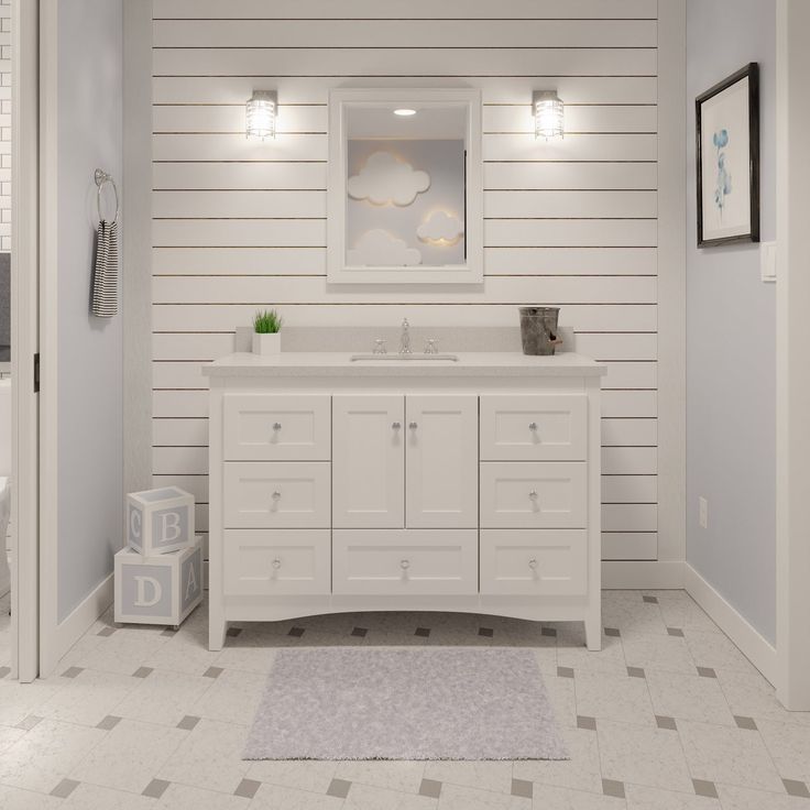 a white bathroom with two sinks and a large mirror above the sink is decorated in gray and white