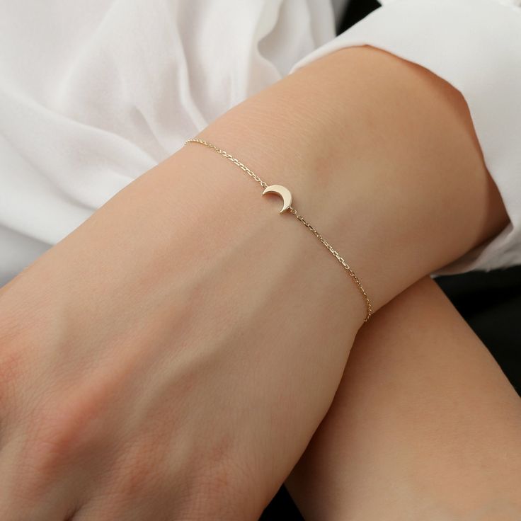 14K Gold Mini Moon Bracelet / Crescent Gold Necklace / Minimal Plain Gol Moon / Daint Moon Bracelet / Valentines Gift / From Sarah Elise ✔ Handmade ✔ Solid Gold ✔ Size of Moon: 7 x 5 mm ✔ The thickness of the Moon: 2 mm Small and sweet, this mini-moon Bracelet can be worn alone for a minimalist look. The moon is not flat but has a thickness to it for a more solid look. Put it on, make a wish, and remember to always shoot for the stars. Available 14K Solid White, Solid Yellow, Solid Rose Gold Wor Elegant Rose Gold Moon Phase Jewelry, Elegant Moon Phase Bracelet, Elegant Moon Charm Bracelet, Elegant Gold Moon Phase Bracelets, Elegant Gold Bracelets With Moon Phase, Elegant Everyday Moon Phase Jewelry, Elegant Moon Phase Jewelry For Everyday Wear, Elegant Adjustable Bracelet With Moon Charm, Elegant Adjustable Crescent Jewelry