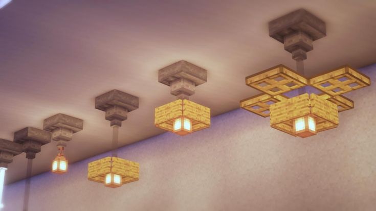 five square lights are hanging from the ceiling