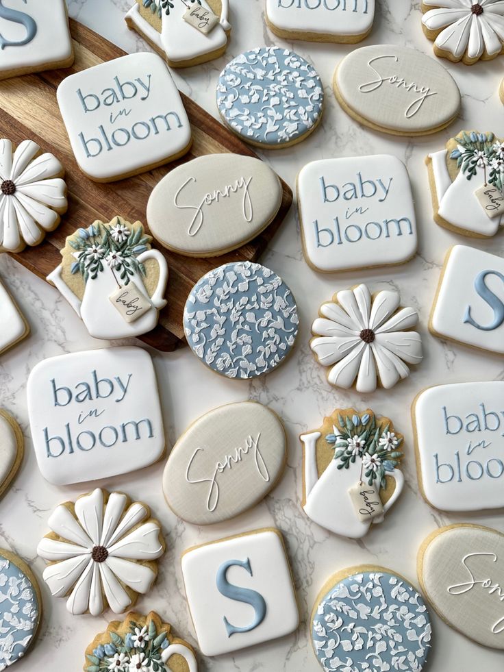 baby shower cookies are laid out on a table