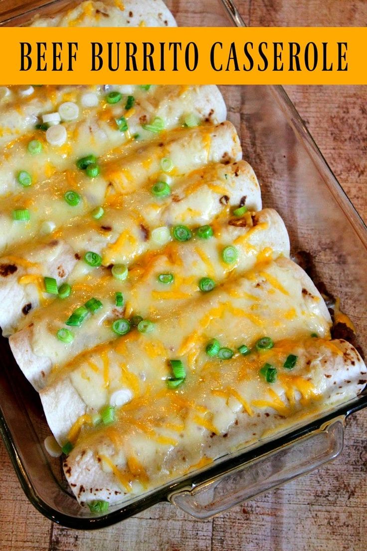 a casserole dish with chicken, cheese and peas in it on a wooden table