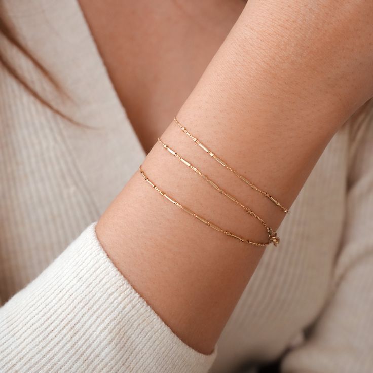 Perhaps the daintiest bracelet in So Niice’s collection (the chain at .7mm with 1 mm gold filled findings), these customizable bracelets feature Morse code detailing which hold the most empowering personal message that you hold dear to yourself. Certainly tiny...but mighty!Need ideas? Wear your name to remind yourself of the importance of loving/accepting one’s self, wear a loved one's name to remind you to be their inspiration, or select from ready to purchase mantras.What will your personal ma 14k Gold Filled Satellite Chain Bracelet As Gift, Minimalist Hypoallergenic 14k Gold Filled Bracelets, Minimalist Hypoallergenic 14k Gold-filled Bracelets, Minimalist Gold Bracelet For Layering, Dainty Tarnish-resistant Bracelets For Layering, Minimalist 14k Gold Chain Bracelet With Extender, Everyday 14k Gold-filled Satellite Chain Bracelet, Layering Bracelets With Delicate Chain, Minimalist 14k Gold Filled Bracelets For Everyday