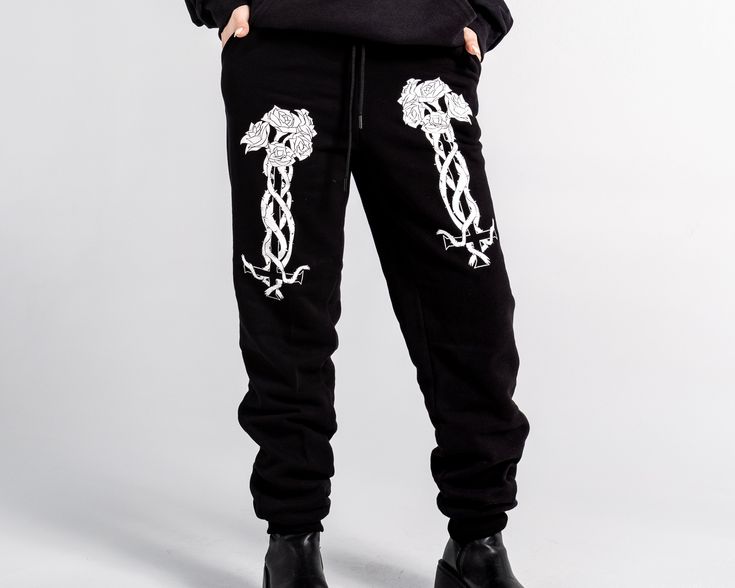 Unisex "Jogger" Style Sweatpants from Forbidden Alchemy. Designed for both comfort and style, these slim-fitting joggers feature a tapered ankle for a sleek silhouette that flatters all body types. Crafted from a premium blend of 80% cotton and 20% polyester, they offer the perfect balance of softness and durability, ensuring all-day comfort and long-lasting wear. Slim Fit: Tailored to hug your body while allowing ease of movement. Tapered Ankle: Provides a modern, streamlined look. Premium Fabr Fall Streetwear Joggers With Comfort Waistband, Casual Black Fitted Joggers, Casual Fitted Black Joggers, Winter Tapered Leg Joggers For Streetwear, Fitted Tapered Leg Streetwear Bottoms, Fitted Tapered Leg Bottoms For Streetwear, Winter Streetwear Sweatpants With Tapered Leg, Winter Streetwear Tapered Leg Sweatpants, Ankle-length Sweatpants For Streetwear In Winter