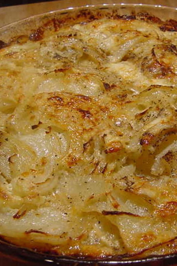 a casserole dish with onions and cheese