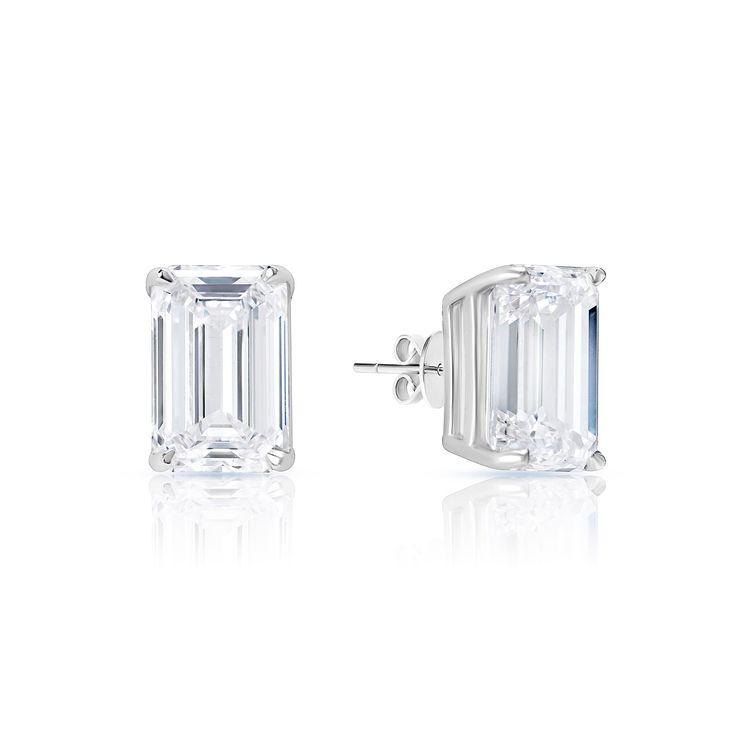 These stud earrings feature a 5.01 carat emerald cut diamond, recognized for its popular rectangular shape and facets that create a hall of mirrors effect. The diamond is graded E for color and VS1 for clarity, meaning it is absolutely stunning and free of visible imperfections. The setting is a simple 4 petite claw prong style in 14k white gold that weighs 4.60 grams, perfect for everyday wear. Whether you are dressing up for a special occasion or just accenting your everyday style, these earri Hall Of Mirrors, Claw Prong, Mirror Effect, Emerald Cut Diamond, Diamond Stud Earrings, Diamond Stud, Emerald Cut Diamonds, 1 Carat, Diamond Earrings Studs