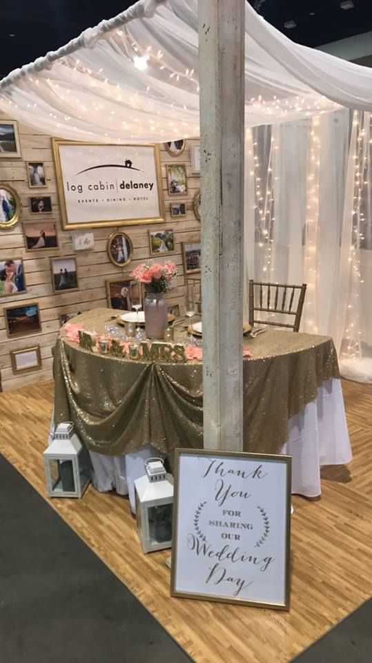 a table with a sign and some lights on it