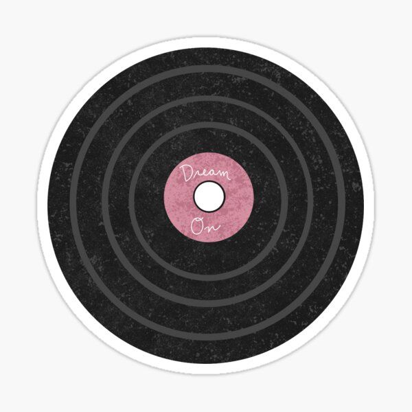 a black and pink record sticker with the words dream on it's center