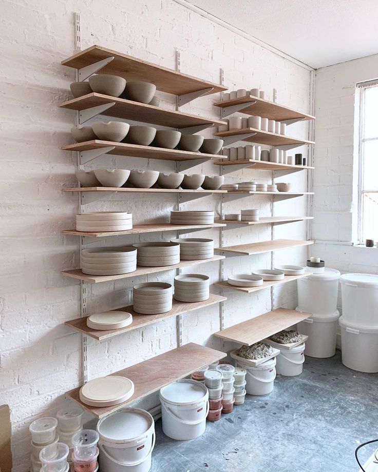 a room filled with lots of white dishes and bowls