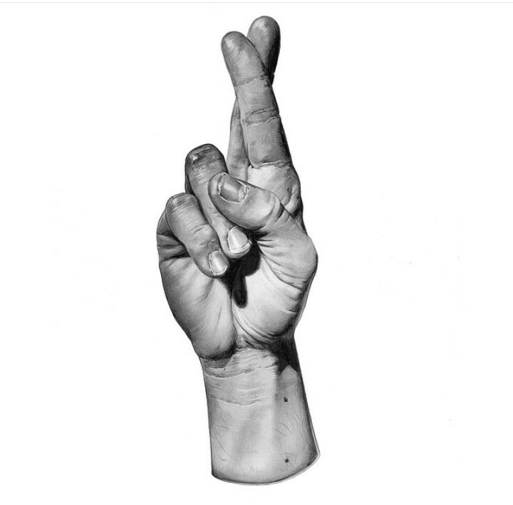 a black and white photo of a person's hand holding up the peace sign