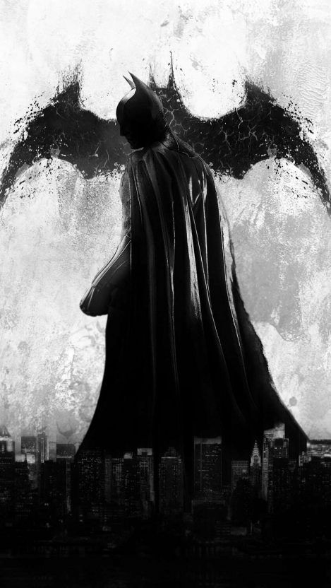 the dark knight is standing in front of a full moon with his wings spread out