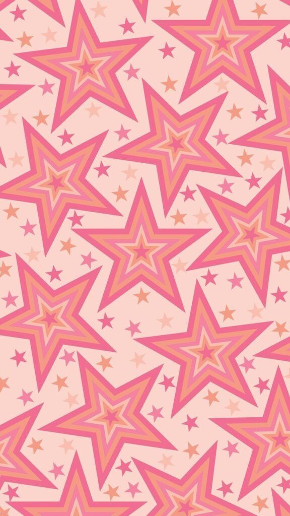 pink and gold stars on a light pink background seamless wallpaper pattern stock photo