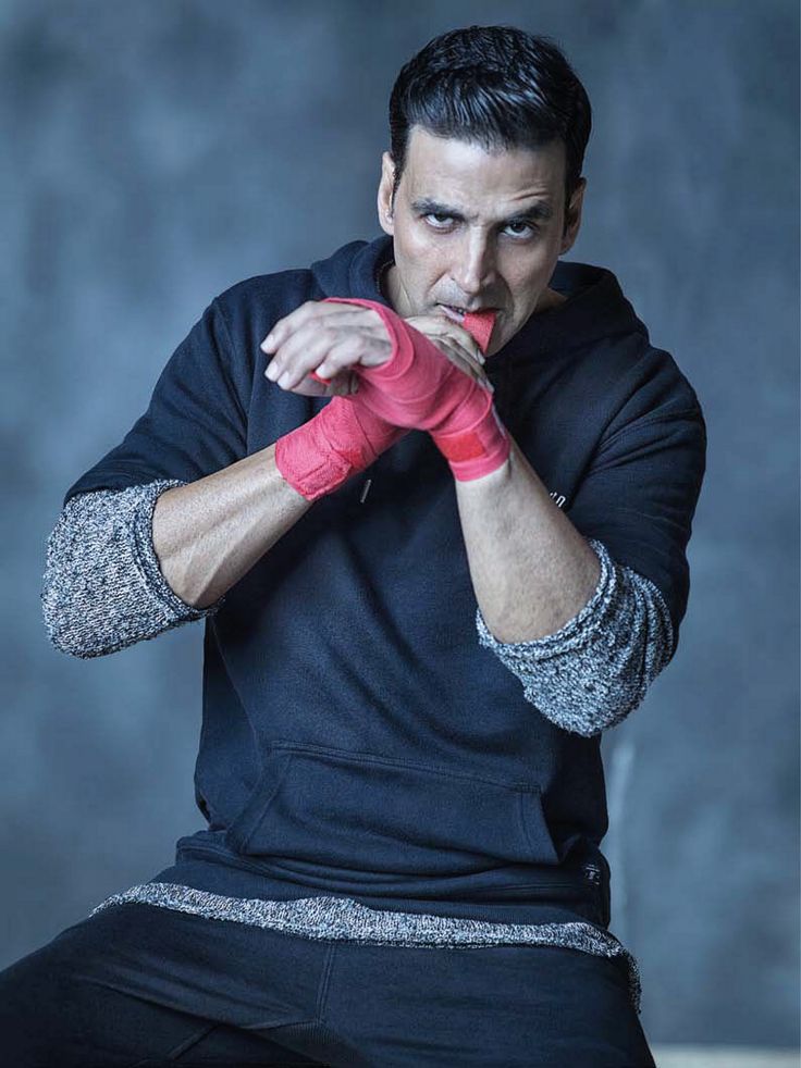 a man in black shirt and red boxing gloves