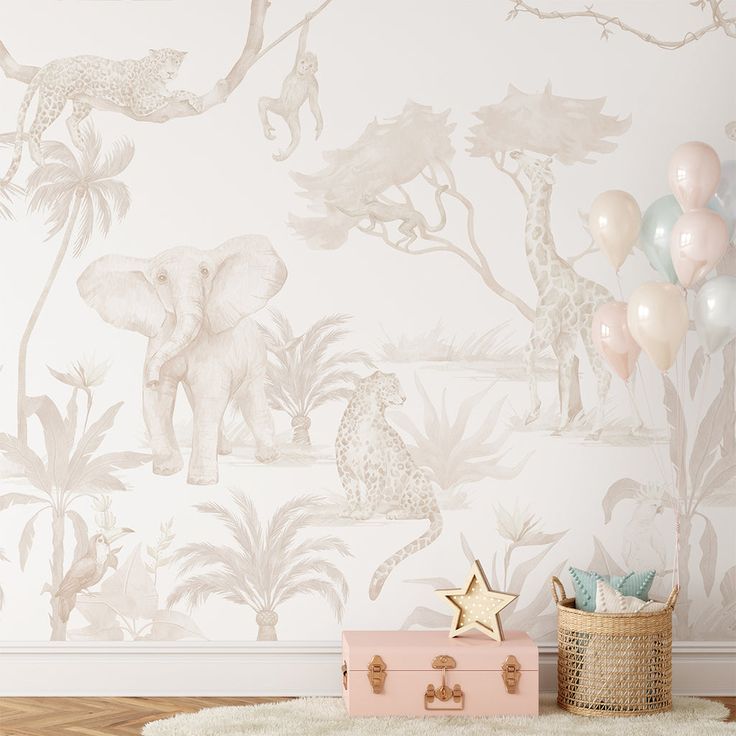 an elephant and giraffe wallpaper in a child's room with balloons