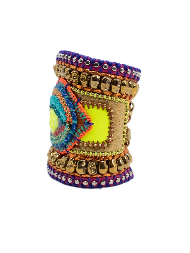 multicolored beaded cuff bracelets on white background