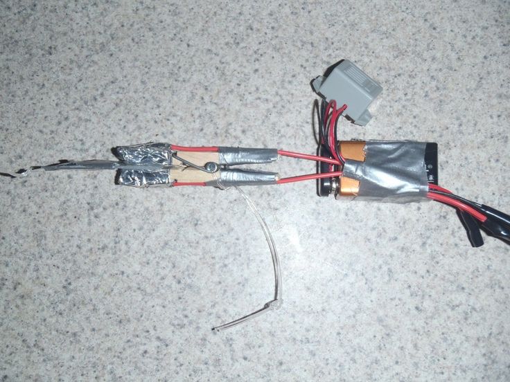 an electronic device connected to wires on the floor