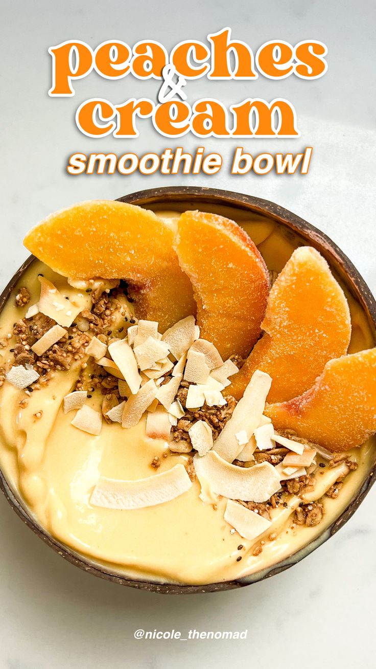 a bowl filled with oranges and cream sitting on top of a white countertop