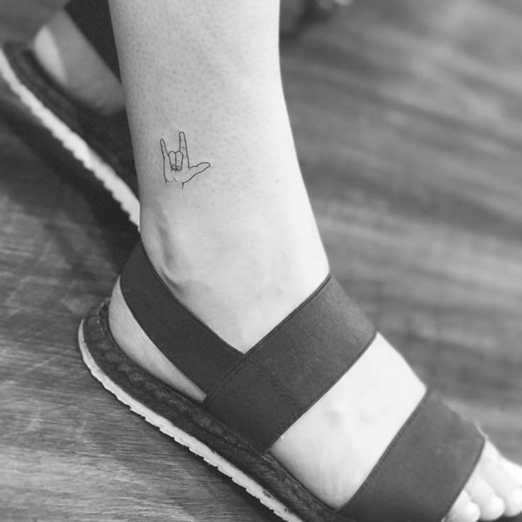 a person with a small tattoo on their foot