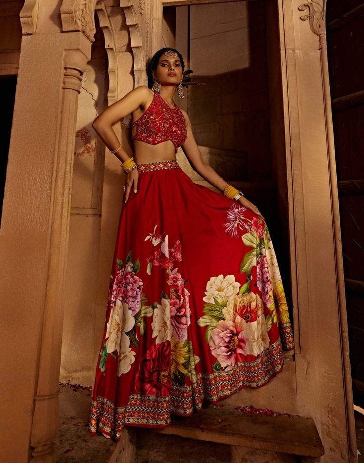 Experience the beauty and comfort of this gulshaad sharara set featuring an intricately embroidered blouse with a stylised back design with heavy tassels and doris coordinated with floral design sharara pants. Perfect outfit to turn heads and make a bold style statement. Bollywood Style Maxi Lehenga With Floral Embroidery, Bollywood Style Floral Embroidered Maxi Lehenga, Bollywood Style Floral Embroidery Maxi Lehenga, Diwali Maxi Length Sharara With Intricate Embroidery, Diwali Floral Embroidered Maxi-length Lehenga, Maxi Length Floral Embroidered Lehenga For Diwali, Red Saree Set With Floral Embroidery, Maxi Lehenga With Floral Embroidery For Festive Occasions, Red Floral Embroidered Saree Set