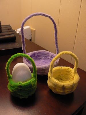 three baskets sitting on top of a wooden table