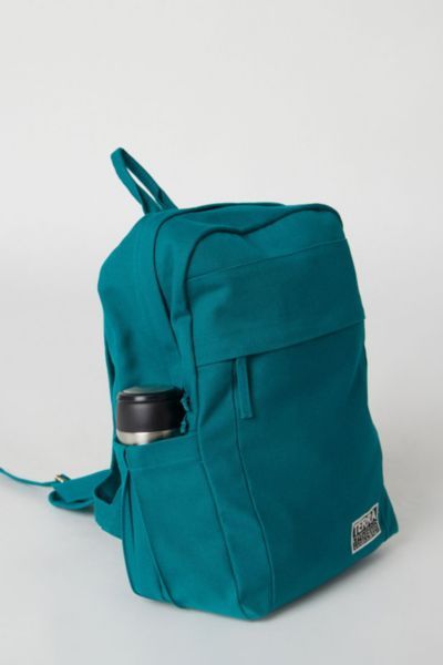 Looking for a sustainably and ethically made backpack for college, work, travel, hiking or other outdoor activities? Our spacious and durable Earth Backpack is the workhorse of our line, built for everyday carry with heavy-duty 14-oz. certified organic cotton canvas that is made in a Fair Trade Certified™ Factory. The generous main compartment is divided with a no-fuss sleeve for your laptop and one small interior pocket to keep things organized. Two water bottle sleeves and the large zippered e Backpacks For College, Backpack For College, Sustainable Backpack, Soap Packing, Handmade Backpacks, Feeding America, College Work, Bottle Sleeves, College School