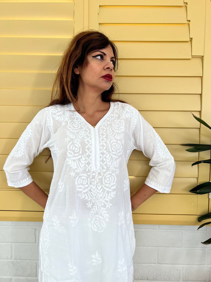 Introducing our White Women's Chikankari Kurta Long, a stunning fusion of style and comfort designed for warm weather elegance. This airy and lightweight Indian cotton white kaftan dress is your perfect companion on scorching summer days. What's more, the softness of this cotton kurta only deepens with each wash, ensuring a delightful wearing experience. This hand-embroidered beauty isn't just a piece of clothing; it's an ideal choice for functions and parties. Whether you're aiming for a classi White Kaftan Dress, White Kaftan, Chikankari Kurta, Cotton Kurta, Long A, Comfort Design, Long Tunic, Indian Cotton, Kaftan Dress