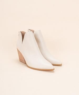 Beverly V Cut Bootie-Beige – Mota Boutique Spring Ankle Boots With Stacked Heel, Ankle Boots With Stacked Heel For Spring, Spring Boots With Reinforced Heel And Medium Width, Trendy Leather Wedge Boots For Spring, Cream Summer Ankle Boots, Cream Heeled Boots For Spring Workwear, White High Heel Wedge Boots For Spring, Chic Spring Boots With Stacked Heel, Chic Spring Heeled Boots With Stacked Heel