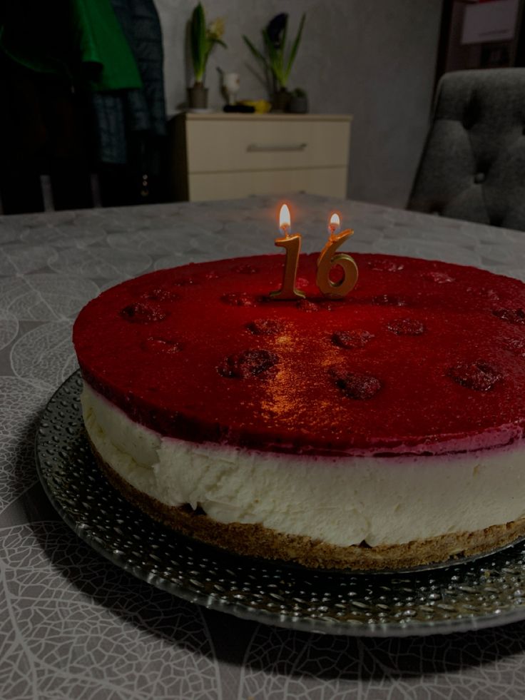 a cake that is sitting on top of a table with candles in the middle of it