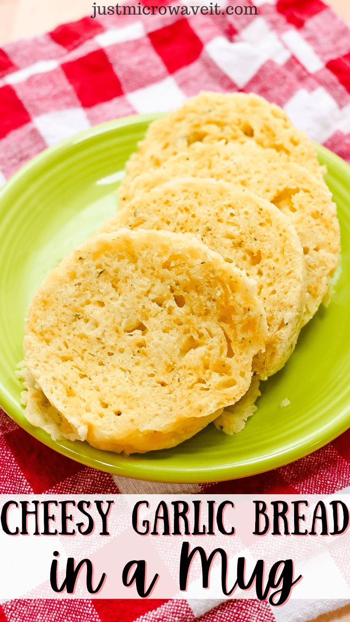 two cheesy garlic bread in a mug on a green plate with red and white checkered tablecloth